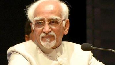 BJP slams Ansari, releases photo with Pakistan journalist BJP slams Ansari, releases photo with Pakistan journalist