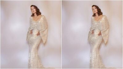 Styled by fashion stylist Sayali Vidya, Hina wore her shoulder-length tresses open in soft wavy curls as she posed for the cameras. (Instagram/@realhinakhan)