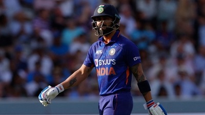 India's Virat Kohli walks after being caught out by England's Jos Buttler&nbsp; (Reuters)