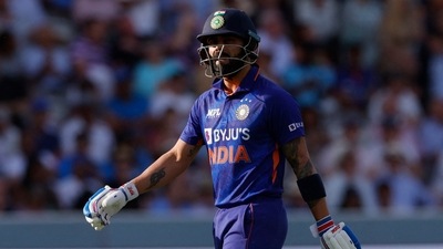 India's Virat Kohli walks after being caught out by England's Jos Buttler&nbsp; (Action Images via Reuters)