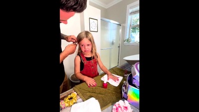 The image form the viral Instagram video shows the dad consoling the girl after she fails to put on nail polish properly. (Instagram/@toddlertok)