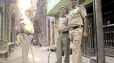 Delhi Police personnel outside the residence of the man who shot his wife and daughters and killed himself in Jaffrabad. (HT PHOTO) Delhi Police personnel outside the residence of the man who shot his wife and daughters and killed himself in Jaffrabad. (HT PHOTO)
