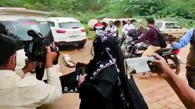A relative of a victim of the July 6 communal violence throws back the compensation money which was provided by former Karnataka chief minister Siddaramaiah towards his car at Kerur in Bagalkot district, (PTI) A relative of a victim of the July 6 communal violence throws back the compensation money which was provided by former Karnataka chief minister Siddaramaiah towards his car at Kerur in Bagalkot district, (PTI)