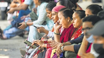 Parents of the candidates wait during examination. Parents of the candidates wait during examination.