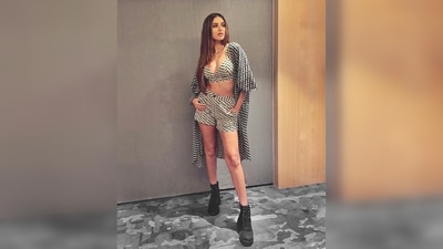 Tara Sutaria's three piece boho set comprises of a cropped top, shorts and a cape. It is from the clothing line Arabellaa and her boots from The Cai Store. (Instagram/@specemuffin27)