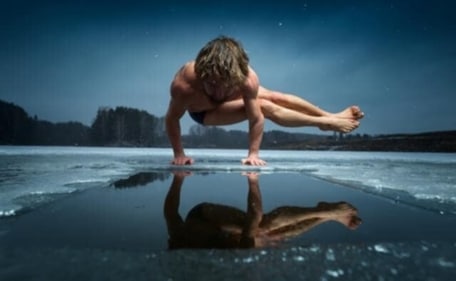 Man doing yoga (parsva bakasana) on a frozen lake. (Shutterstock) Man doing yoga (parsva bakasana) on a frozen lake. (Shutterstock)