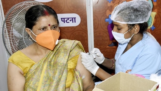 Patna, India - July 13, 2022: A health worker administers a dose of Covid-19 vaccine to a woman at Guru Nanak Bhawan in Patna, Bihar, India on Wednesday, Photo by Santosh Kumar/Hindustan Times)