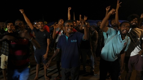 People celebrate the resignation of Gotabaya Rajapaksa from the President's post.(AFP)