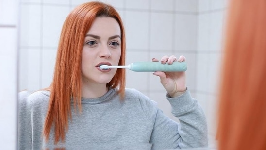 After dinner, teach yourself to think of the kitchen as being closed for the night, and brush your teeth - you will want to eat less with a newly cleaned mouth(Pixabay)