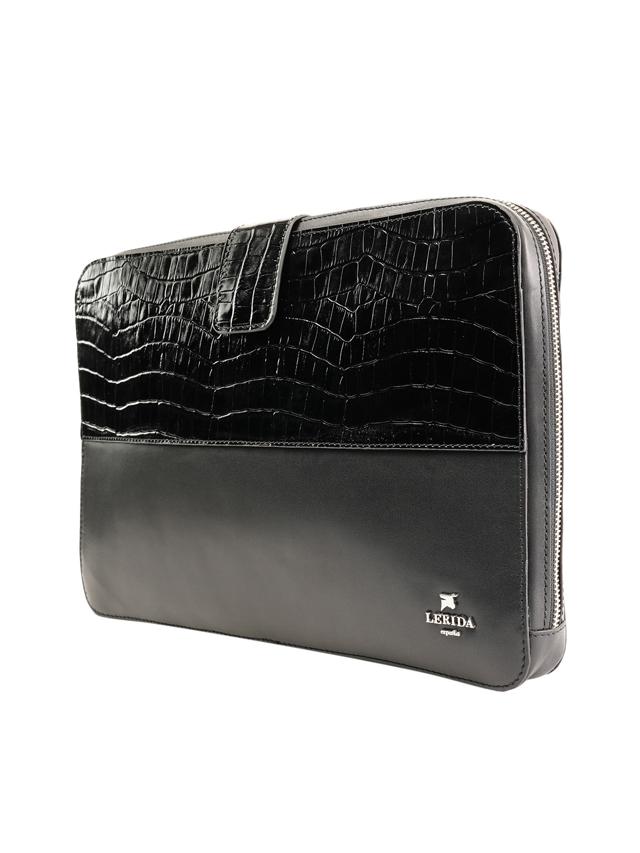 Carry a sharp looking laptop sleeve that’s dressy enough for a work meeting. (Dual textured sleek leather laptop sleeve by Lerida on Roperro)