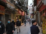 FILE PHOTO: People wear masks as they walk near Ruins of St. Paul’s, following the coronavirus outbreak in Macau