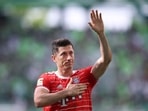 Bayern Munich's Polish forward Robert Lewandowski greets and holds a hand on his heart after a Bundesliga match.