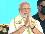 Prime Minister Narendra Modi greets the crowd at Jalaun during the inauguration of Bundelkhand Expressway