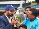 Madhya Pradesh's captain Aditya Shrivastava and head coach Chandrakant Pandit kiss the trophy after winning final Ranji Trophy(PTI) Madhya Pradesh's captain Aditya Shrivastava and head coach Chandrakant Pandit kiss the trophy after winning final Ranji Trophy(PTI)