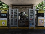 Policemen ride motorcycle at a Lanka fuel station in Colombo. (File image) Policemen ride motorcycle at a Lanka fuel station in Colombo. (File image)