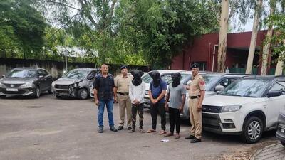 The vehicle lifters and the recovered cars in the custody of Chandigarh Police on Saturday. (HT Photo)