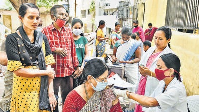 A medic administers a booster shot of Covid vaccine to a woman in Hyderabad on Friday. (PTI) A medic administers a booster shot of Covid vaccine to a woman in Hyderabad on Friday. (PTI)