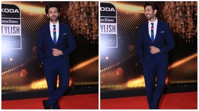 Actor Kartik Aaryan won the award for India’s Most Stylish (Male) at HT India's Most Stylish 2022. For the occasion, he wore a black pantsuit teamed with a white shirt and matching tie. (HT Photo/Varinder Chawla) Actor Kartik Aaryan won the award for India’s Most Stylish (Male) at HT India's Most Stylish 2022. For the occasion, he wore a black pantsuit teamed with a white shirt and matching tie. (HT Photo/Varinder Chawla)