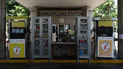 Policemen ride motorcycle at a Lanka fuel station in Colombo. (File image) (AFP) Policemen ride motorcycle at a Lanka fuel station in Colombo. (File image) (AFP)