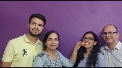 Anjali Goyal celebrating her feat with her parents and brother in Panipat on Saturday. She has secured the top position in the state and 7th position in the country in the final exam conducted by the Institute of Chartered Accountants of India (ICAI). (HT Photo)