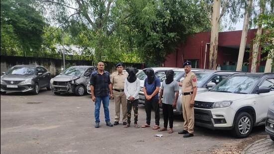 The vehicle lifters and the recovered cars in the custody of Chandigarh Police on Saturday. (HT Photo)