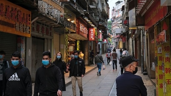 FILE PHOTO: People wear masks as they walk near Ruins of St. Paul’s, following the coronavirus outbreak in Macau(REUTERS)