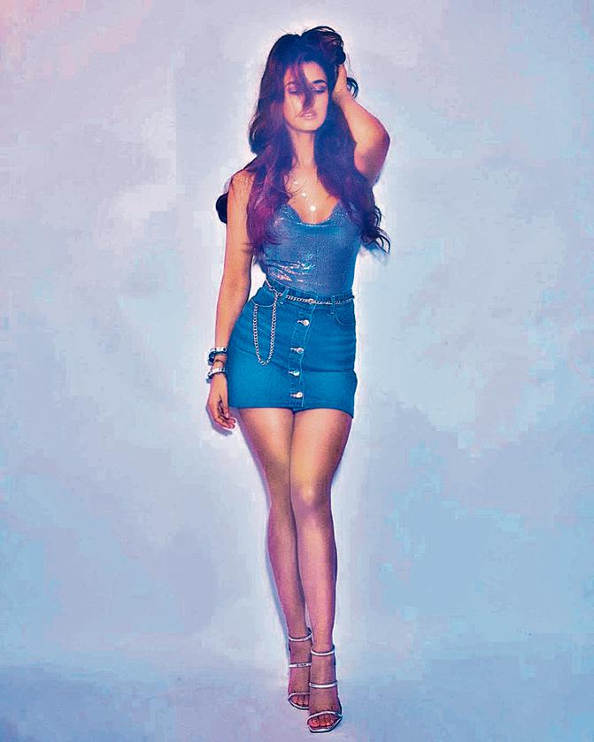 Disha Patani pairs a cowl chainmail top with a mini denim skirt