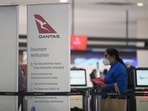 A passenger queues at a Qantas Airways Ltd. check-in counter at Sydney Airport in Sydney, Australia,. Qantas, which carries the slogan A passenger queues at a Qantas Airways Ltd. check-in counter at Sydney Airport in Sydney, Australia,. Qantas, which carries the slogan