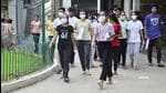 Students leaving the examination centre after appearing in the NEET exam in Ludhiana. (Harvinder Singh/HT)