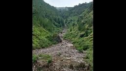 Debris scattered after a cloudburst in Kumarsain of Shimla district on Sunday. (HT Photo)