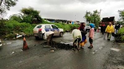 A major reason behind the traffic congestion is the potholes on roads that have badly affected vehicular movement (HT PHOTO)