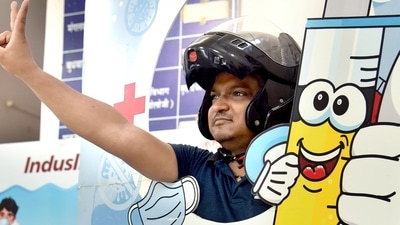 India Covid-19 vaccination drive: A beneficiary shows a victory sign while posing for a picture at a selfie point after receiving a precautionary dose of the COVID-19 vaccine in Bikaner on Saturday. (ANI Photo) India Covid-19 vaccination drive: A beneficiary shows a victory sign while posing for a picture at a selfie point after receiving a precautionary dose of the COVID-19 vaccine in Bikaner on Saturday. (ANI Photo)
