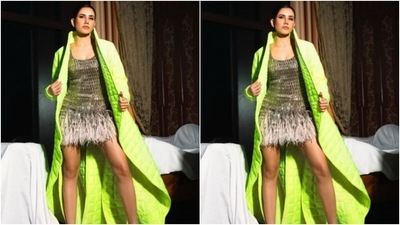 Sonnalli decked up in a sleeveless silver sequin dress that featured decorations in silver embellishments all throughout the dress. The dress cascaded to feather details at the end. (Instagram/@sonnalliseygall)