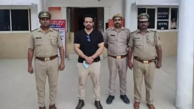 Gaurav Taneja with Noida Police personnel following his arrest.