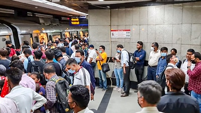 Commuters wait in a queue to board a metro at a platform inside Mandi House metro station after services were delayed on the Blue Line of the Delhi Metro, in New Delhi, Monday, June 6, 2022. (PTI Photo/Subhav Shukla) Commuters wait in a queue to board a metro at a platform inside Mandi House metro station after services were delayed on the Blue Line of the Delhi Metro, in New Delhi, Monday, June 6, 2022. (PTI Photo/Subhav Shukla)