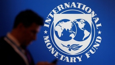 &nbsp;A participant stands near a logo of IMF at the International Monetary Fund - World Bank annual meeting &nbsp;in Nusa Dua, Bali, Indonesia. (REUTERS)