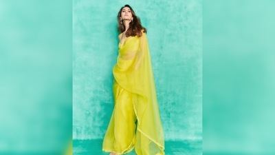Vaani Kapoor amped up her look by teaming the bright yellow see-through saree with statement earrings and stilettoes. (Instagram/@)_vaanikapoor_) Vaani Kapoor amped up her look by teaming the bright yellow see-through saree with statement earrings and stilettoes. (Instagram/@)_vaanikapoor_)