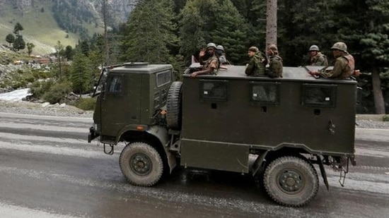 Indian army soldiers are seen atop a vehicle on a highway leading to Ladakh. (REUTERS)