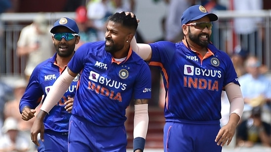 India's Hardik Pandya, 2nd right, celebrates with captain India's Rohit Sharma, right, after dismissing England's Jos Butler(AP)