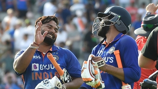 India's Rishabh Pant, left, and India's Ravindra Jadeja leave the pitch at the end of play as they win(AP)