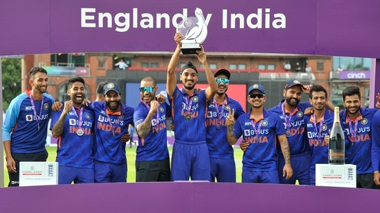 India players celebrate during trophy presentation after India win the third one day international cricket match(AP)