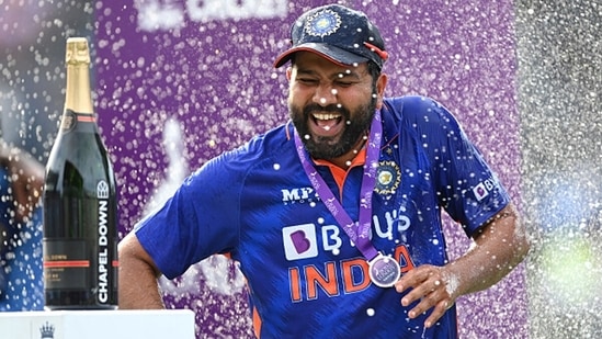 India captain Rohit Sharma celebrates by being sprayed with champagne.&nbsp;(Getty)