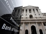 FILE PHOTO: The Bank of England (BoE) building is reflected in a sign, London, Britain.