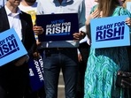 Conservative Party members and activists hold up signs during a visit from Former Chancellor of the Exchequer Rishi Sunak, in Teesport, Redcar, Britain.