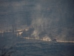 Fire engines drive during a wildfire in El Pont de Vilomara, north of Barcelona, Spain.&nbsp;
