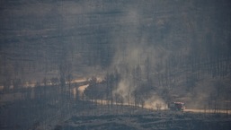 Fire engines drive during a wildfire in El Pont de Vilomara, north of Barcelona, Spain. 