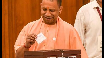 •UP chief minister Yogi Adityanath casts his vote for the presidential election, at the Tilak Hall in UP Vidhan Bhavan, in Lucknow, Monday. (PTI Photo) •UP chief minister Yogi Adityanath casts his vote for the presidential election, at the Tilak Hall in UP Vidhan Bhavan, in Lucknow, Monday. (PTI Photo)