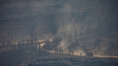 Fire engines drive during a wildfire in El Pont de Vilomara, north of Barcelona, Spain.&nbsp; (REUTERS)