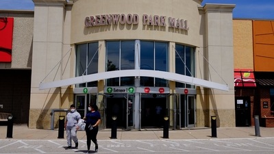 Shoppers leave the Greenwood Park Mall in this file image of the site of shooting, in Greenwood, Indianapolis. &nbsp; (AP File)