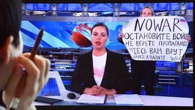  When Russian journalist Marina Ovsyannikova (holding placard) stormed a live TV broadcast to denounce the war in Ukraine, she expected a backlash from Russia but not so much from the rest of the world. (AFP) When Russian journalist Marina Ovsyannikova (holding placard) stormed a live TV broadcast to denounce the war in Ukraine, she expected a backlash from Russia but not so much from the rest of the world. (AFP)